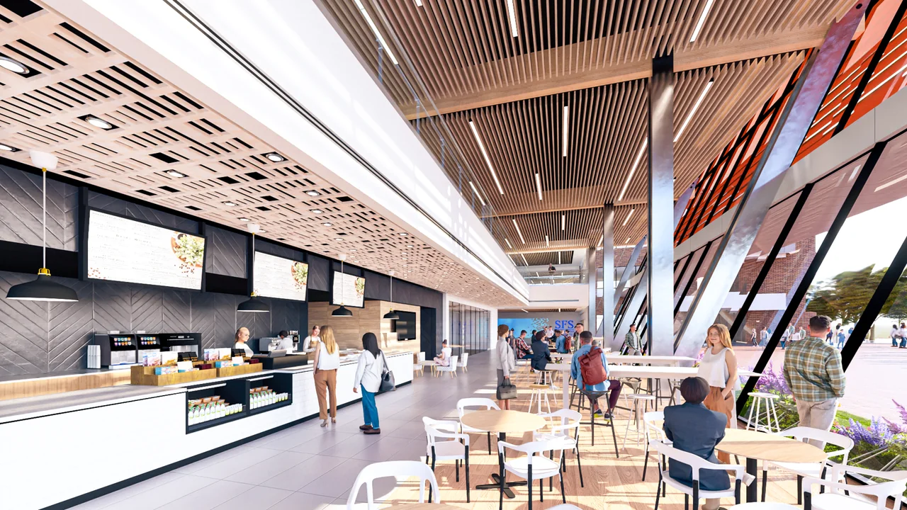 A rendered café occupies a bright, glazed communal space.
